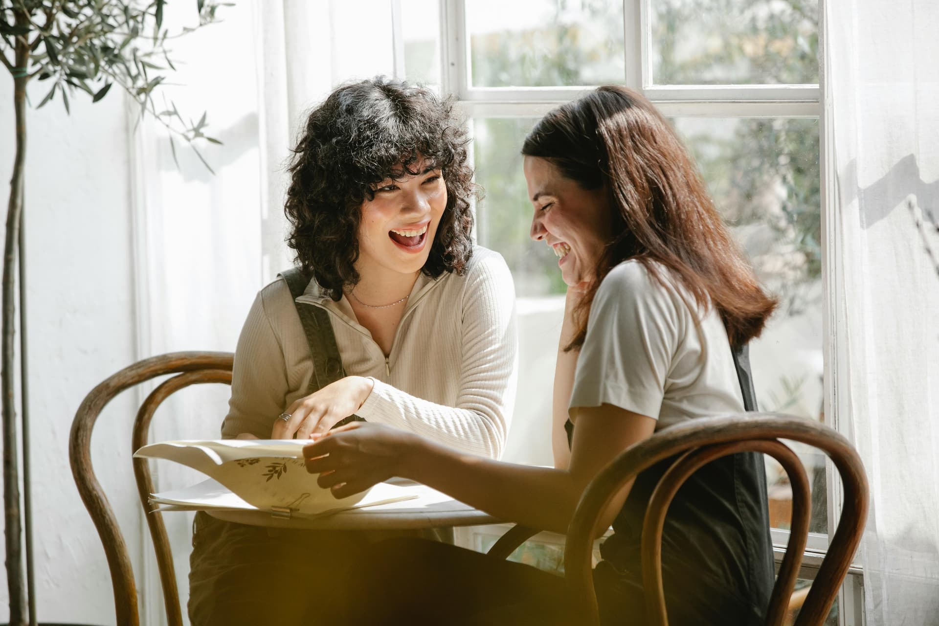 2 girls laughing and talking